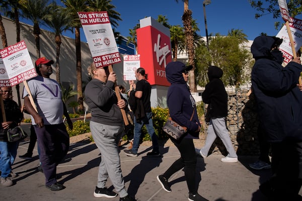 Members of the Culinary Workers Union picket in front of the Virgin Hotels Las Vegas, Friday, Nov. 15, 2024, in Las Vegas. (AP Photo/John Locher)