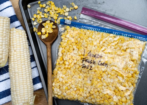 To freeze fresh corn, simply cut the kernels off the cob, place in freezer-grade plastic bags, press to remove the air, then flatten and seal. Chadwick Boyd for The Atlanta Journal-Constitution 