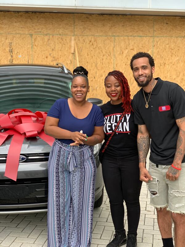 Rayshard Brooks' wife Tomika Miller, left, with Slutty Vegan owner Pinky Cole and Big Dave's Cheesesteaks owner Derrick Hayes.