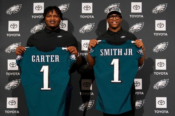 Newly drafted Philadelphia Eagles' Jalen Carter, left, and Nolan Smith pose for a photo after a news conference at the NFL football team's training facility, Friday, April 28, 2023, in Philadelphia. (AP Photo/Matt Slocum)