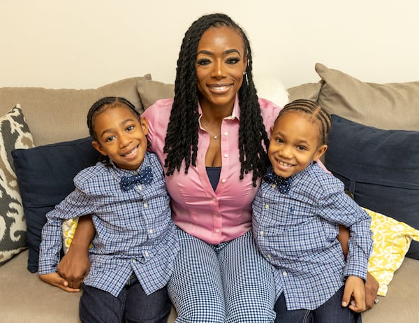 Shea Guillory and 6-year-old twins Sawyer, left, and Saxton, right, are at their home Monday, January 17, 2022.  Guillory manages the busy boys and  Sawyer's sickle-cell disease while home schooling with help from her mother; while her husband works as a government contractor.  (Jenni Girtman for The Atlanta Journal-Constitution)