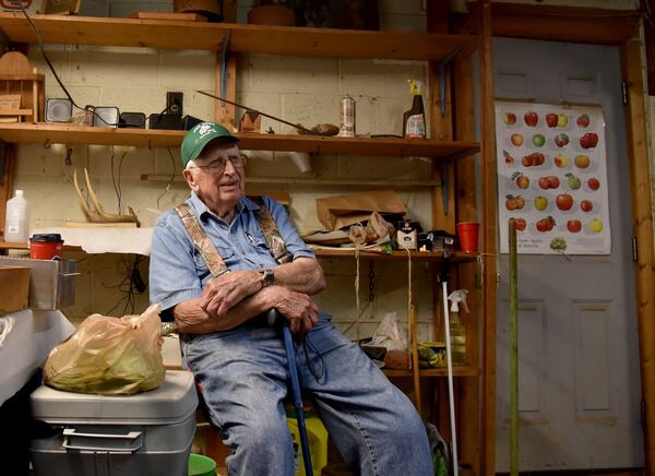 Jim Lawson has raised and grafted apple trees for more than 60 years and is credited with restoring many vintage and heirloom varieties that might of disappeared. At 89 years old, he occasionally bench-grafts, but nowhere near the rate he once did. BRANT SANDERLIN/BSANDERLIN@AJC.COM