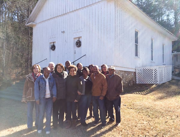 Taking a break from their community meeting, the citizens of the place commonly known as Chubbtown pose in front of the nearly 150-year-old Chubb Chapel. (Steve Hummer/shummer@ajc.com