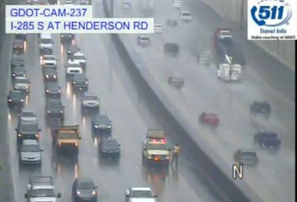 An emergency HERO worker opened a drain to ease flooding on I-285 South in DeKalb County. (Credit: Georgia Department of Transportation)