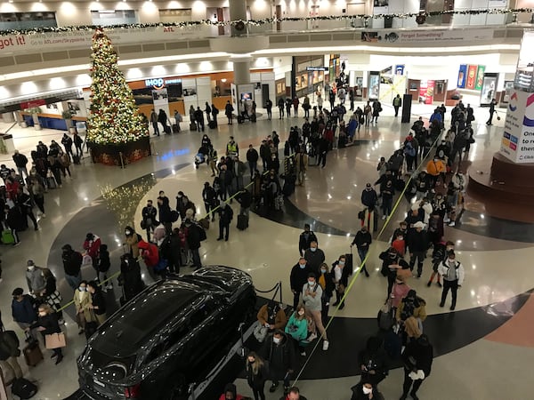 Lines for security screening stretched through the domestic terminal atrium and down hallways at Hartsfield-Jackson International Airport on Wednesday, the day before Thanksgiving.