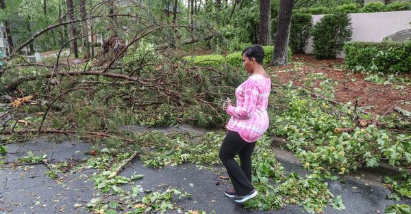 May 3, 2021 Atlanta: Atlanta Mayor Keisha Lance Bottoms surveys the damage on New Britain Drive in her neighborhood after a severe thunderstorm swept through the city on Monday morning May 3, 2021. A possible tornado tracked on the ground for several miles, starting in Douglas County and moved northeast through the city into northern DeKalb County, according to Channel 2 Action News meteorologists. The National Weather Service will conduct a survey to confirm the tornado and determine its strength. In Atlanta, fire crews responded to a number of calls for trees down on homes and on the streets along the Cascade Road corridor. (John Spink / John.Spink@ajc.com)

