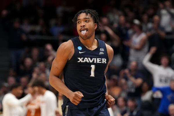 Xavier guard Marcus Foster reacts after scoring during the second half of a First Four college basketball game against Texas in the NCAA Tournament, Wednesday, March 19, 2025, in Dayton, Ohio. (AP Photo/Jeff Dean)