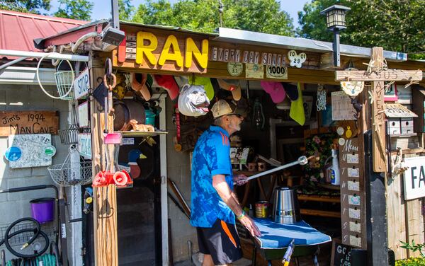 Jim Merritt, 73, of Buford, talks about his running career in his man cave.  PHIL SKINNER FOR THE ATLANTA JOURNAL-CONSTITUTION.