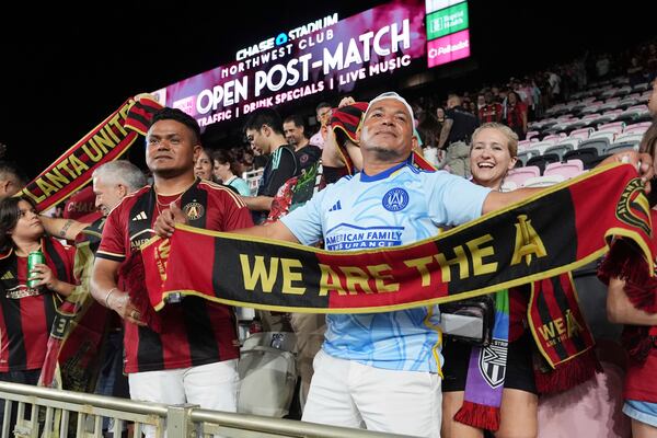 Atlanta United fans celebrate at the end of their MLS playoff opening round soccer match against Inter Miami, Saturday, Nov. 9, 2024, in Fort Lauderdale, Fla. (AP Photo/Lynne Sladky)