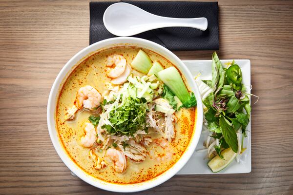  The Curry Laksa at new Asian restaurant CO features shrimp, shredded chicken, bun rice noodles, cucumber, basil and baby bok choy in a spicy coconut broth./Photo credit: CO Restaurant