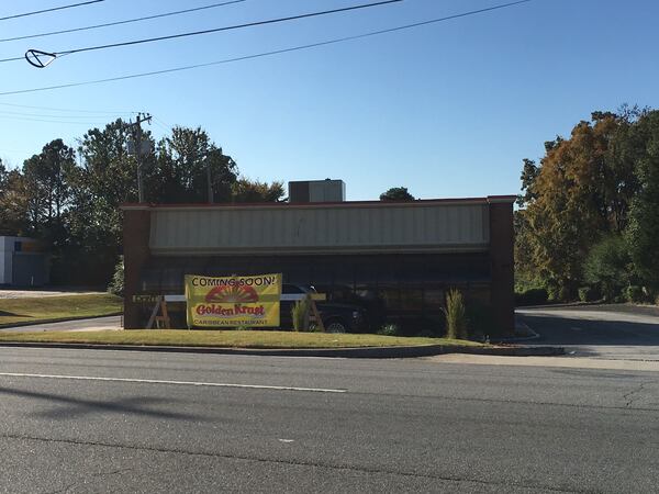 A sign outside the former Wendy's location at 676 Duluth Highway in Lawrenceville boasts that Golden Krust Caribbean Bakery and Grill is "coming soon." TYLER ESTEP / TYLER.ESTEP@AJC.COM