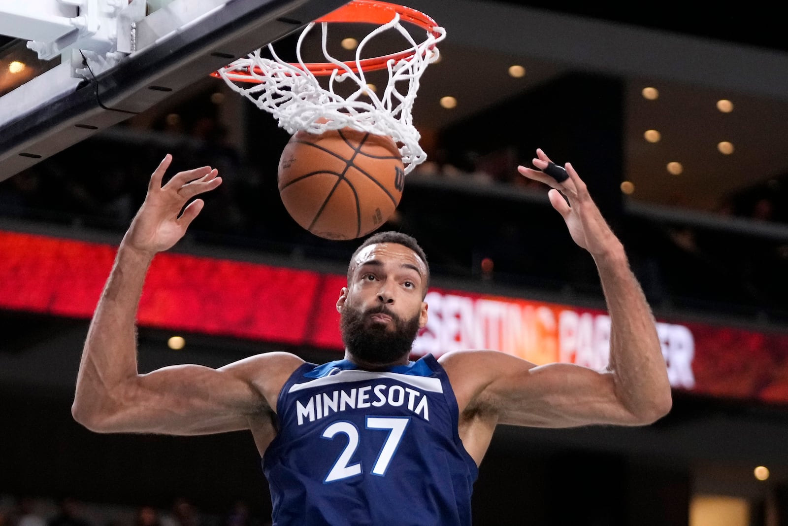 Minnesota Timberwolves center Rudy Gobert dunks during the first half of a preseason NBA basketball game against the Los Angeles Lakers, Friday, Oct. 4, 2024, in Palm Desert, Calif. (AP Photo/Mark J. Terrill)