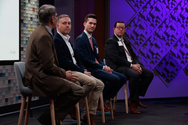 Atlanta Journal-Constitution government reporter Mark Niesse (far left) moderates a discussion with Georgia Republican Party Chairman Josh McKoon and Democratic Party of Georgia First Vice Chair Matthew Wilson about campaigns and cybersecurity at a summit Google hosted Tuesday. (Natrice Miller/ Natrice.miller@ajc.com)