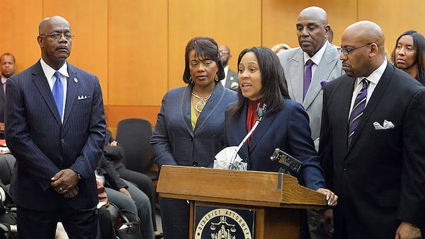 PROSECUTION TEAM SPEAKS--APRIL 14, 2015 ATLANTA Fulton County prosecutors Fani Willis and Clint Rucker speak as DA Paul Howard (left) and Dr. Bernice King listen, during a press conference following sentencing for 10 of the 11 defendants convicted of racketeering and other charges in the Atlanta Public Schools test-cheating trial. (Atlanta Journal-Constitution, Kent D. Johnson, Pool)