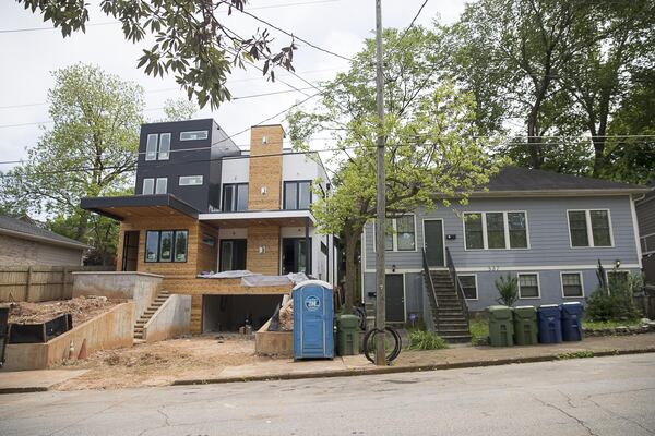  A newly constructed modern house sits next to an updated property on Morgan Street NE in Atlanta’s Old Fourth Ward community. Once a middle-class working neighborhood that birthed Martin Luther King Jr., the Old Fourth Ward is now selling homes averaging $660,000. That is bringing in more affluent residents, shops and amenities, but it is also pushing some people out who can no longer afford to pay their taxes now that property values have gone up. (ALYSSA POINTER/ALYSSA.POINTER@AJC.COM)