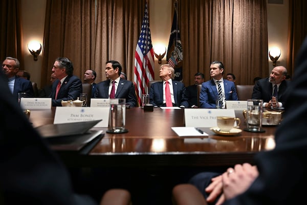 President Donald Trump holds his first Cabinet meeting at the White House in Washington, Wednesday, Feb. 26, 2025. (Pool via AP)