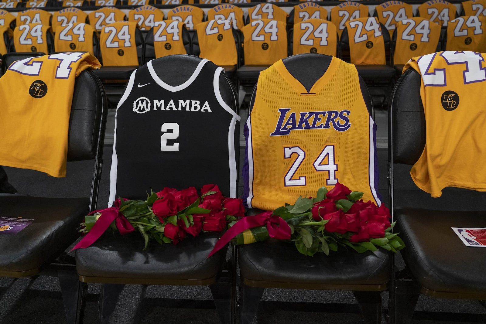 Flowers were placed on courtside seats in honor of Kobe Bryant and his daughter Gianna at the Staples Center in Los Angeles before the Los Angeles Lakers played the Portland Trail Blazers on Jan. 31. PHILIP CHEUNG / THE NEW YORK TIMES