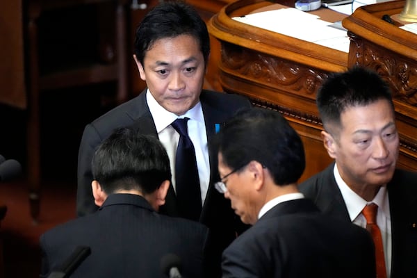 Yuichiro Tamaki, leader of the Democratic Party for the People, makes a parliamentary vote for a new leader during a special parliamentary session of the lower house, Monday, Nov. 11, 2024, in Tokyo. (AP Photo/Eugene Hoshiko)