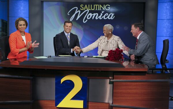 Left to right - Jovita Moore, Justin Farmer, Monica Pearson and Glenn Burns celebrate the career of Monica Pearson in 2012. JOHN SPINK / JSPINK@AJC.COM