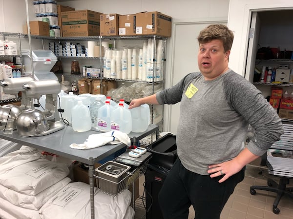 Ryan Boon, who co-owns a Da Vinci s Donuts in Dunwoody, was able to open his shop Wednesday. Boon s crew bought as much bottled water as they could find to ensure they could open and make doughnuts and coffee. J. SCOTT TRUBEY / SCOTT.TRUBEY@AJC.COM