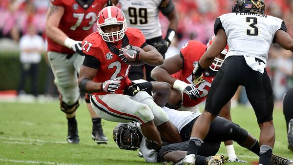 October 15, 2016 Athens, GA: Georgia Bulldogs running back Nick Chubb is brought down by Vanderbilt Commodores linebacker Ja'karri Thomas during the 3rd quarter at Sanford Stadium Saturday October 15, 2016. BRANT SANDERLIN/BSANDERLIN@AJC.COM