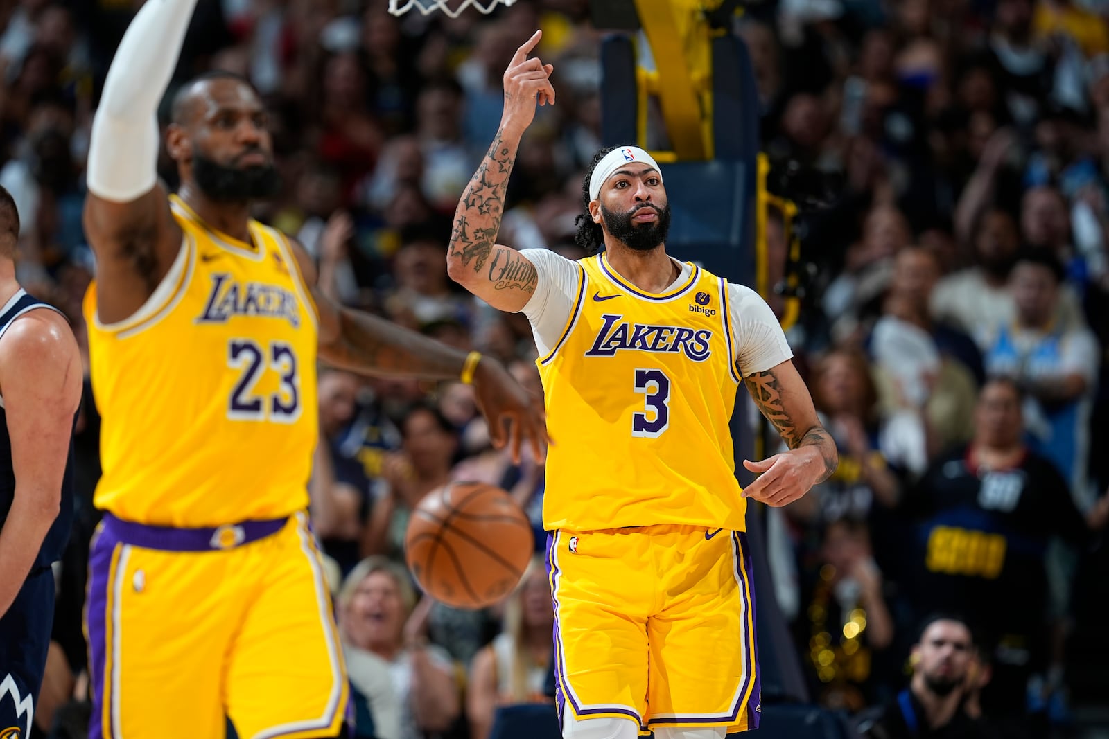 FILE - Los Angeles Lakers forwards LeBron James (23) and Anthony Davis (3) in the second half of Game 5 of an NBA basketball first-round playoff series Monday, April 29, 2024, in Denver. (AP Photo/David Zalubowski, File)