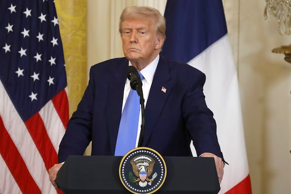 President Donald Trump listens during a joint press conference with France's President Emmanuel Macron in the East Room of the White House in Washington, Monday, Feb. 24, 2025. (Ludovic Marin/Pool via AP)