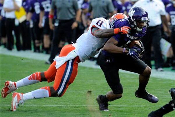 Syracuse's Marquis Spruill, (11), tackles Northwestern University's Stephen Buckley, (8) in the first half of an NCAA college football game Saturday, Sept. 7, 2013 in Evanston, Ill. (AP Photo/Matt Marton) Syracuse's Marquis Spruill, (11), tackles Northwestern University's Stephen Buckley, (8) in the first half of an NCAA college football game Saturday, Sept. 7, 2013 in Evanston, Ill. (AP Photo/Matt Marton)