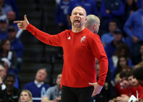 Louisville head coach Pat Kelsey questions a call during the second half of an NCAA college basketball game against Kentucky in Lexington, Ky., Saturday, Dec. 14, 2024. (AP Photo/James Crisp)