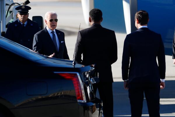 President Joe Biden greets  Atlanta Mayor Andre Dickens and U.S. Sen Jon Ossoff as he arrives at the Atlanta Hartsfield-Jackson Int. Airport; he is scheduled to deliver remarks at Ebenezer Baptist Church on Sunday, January 15, 2023.  Miguel Martinez / miguel.martinezjimenez@ajc.com 