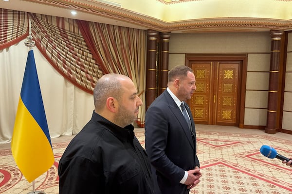 Ukrainian Head of Presidential Office Andriy Yermak, right, and Ukrainian Minister of Defense Rustem Umerov speak to journalists in Jeddah, Saudi Arabia, Tuesday, March 11, 2025. (AP Photo/Baraa Anwer)