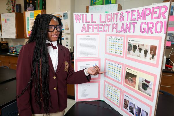 Champion Middle School student Tatiana Bonner talks about her science fair exhibit at Champion Middle School, Wednesday, Jan. 24, 2024, in Stone Mountain. (Jason Getz / jason.getz@ajc.com)