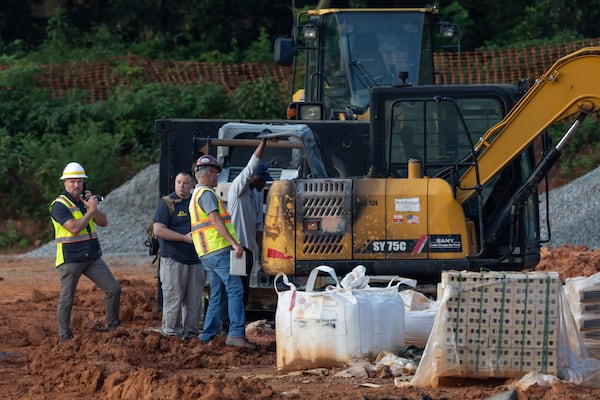 Officials are searching for two people they believe are responsible for setting fire to construction equipment at a townhome development in east Atlanta early Wednesday morning, Aug. 14, 2024. Atlanta police confirmed that the incident is connected to opposition to the city's public safety training center. (John Spink/AJC)