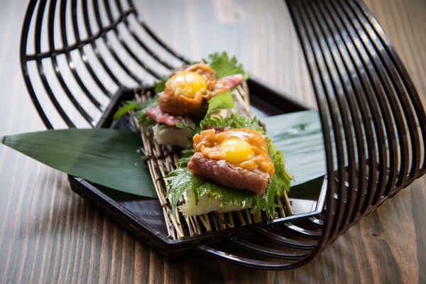 A5 Wagyu and Uni Toast with quail egg, nori puree, shiso, and Jacobsen salt. Credit- Mia Yakel.