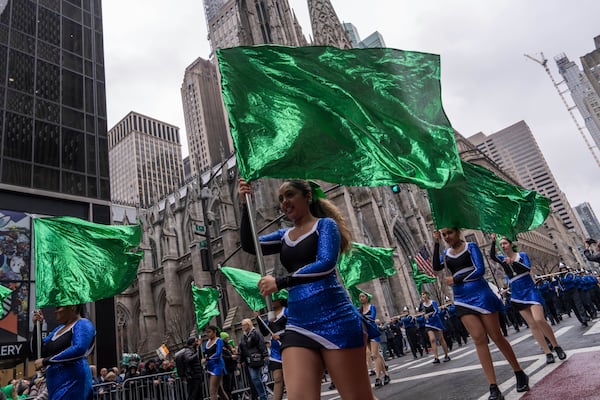 People wave flags during the 264th New York City Saint Patrick's Day Parade, Monday, March 17, 2025 in New York. (AP Photo/Adam Gray)