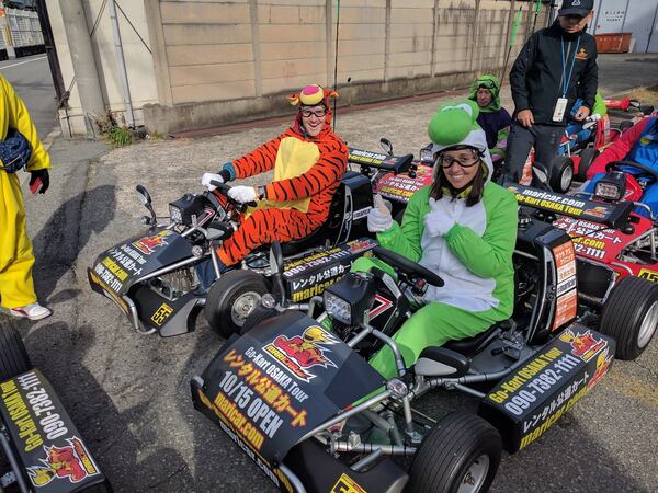 Nate and Jessica Baumgart quit their jobs and sold nearly everything they owned before setting off for a trip around the world last year. The couple is pictured here in costume racing go-karts n Osaka, Japan. CONTRIBUTED