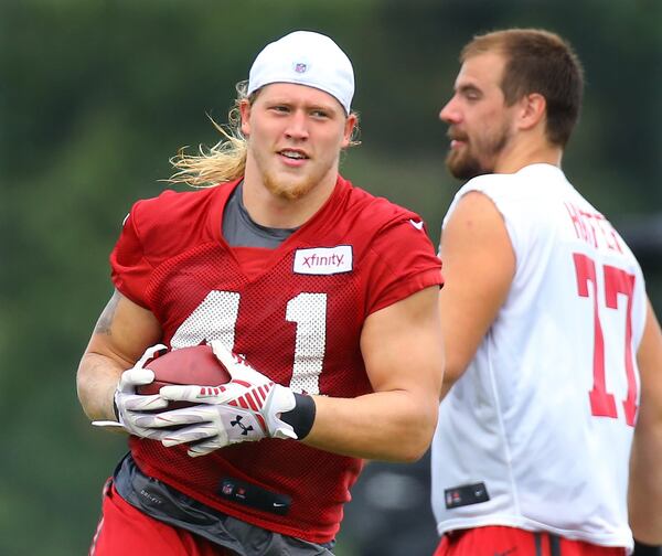 081915 FLOWERY BRANCH: Falcons outside linebacker Tyler Starr returns an interception during team practice on Wednesday, August 19, 2015, in Flowery Branch. Curtis Compton / ccompton@ajc.com