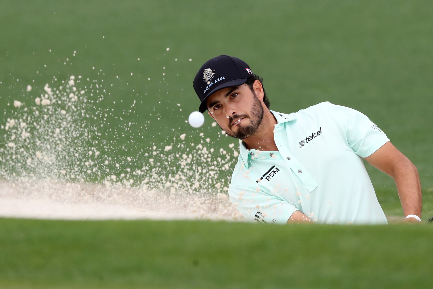 April 10, 2021, Augusta: Abraham Ancer hits his third shot out of the bunker on the second green during the third round of the Masters at Augusta National Golf Club on Saturday, April 10, 2021, in Augusta. Curtis Compton/ccompton@ajc.com