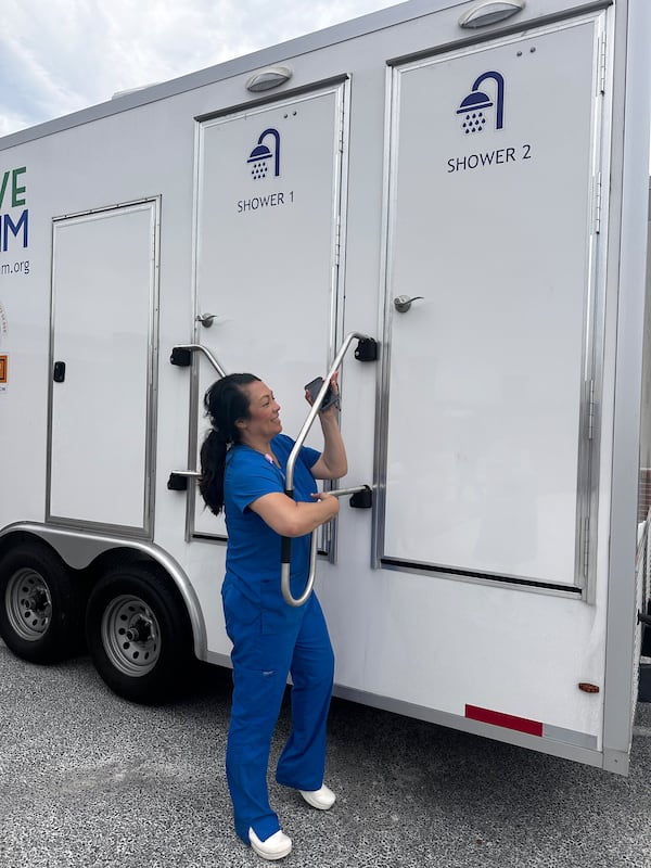 Angela Ammons Handley, CEO of Clinch Memorial Hospital, a 25-bed rural hospital in Homerville in Clinch County, checks out the mobile showers brought in after the storm. (Courtesy of Clinch Memorial Hospital)