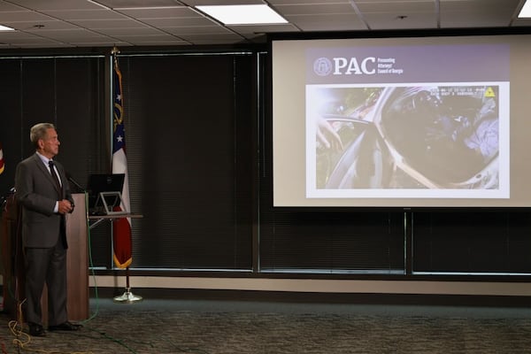 Former Gwinnett County District Attorney Danny Porter shows portions of the surveillance video from the night of Rayshard Brooks' fatal shooting at a news conference Tuesday. 