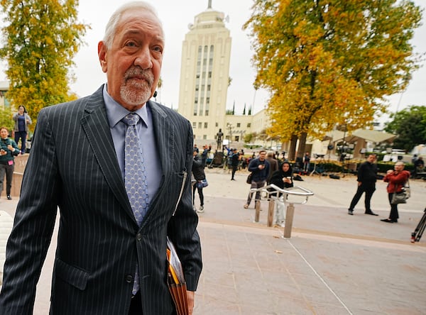 Defense Attorney Mark Geragos, arrives at the Van Nuys courthouse in Los Angeles, for a hearing for Erik and Lyle Menendez, on Monday, Nov. 25, 2024. (AP Photo/Damian Dovarganes)