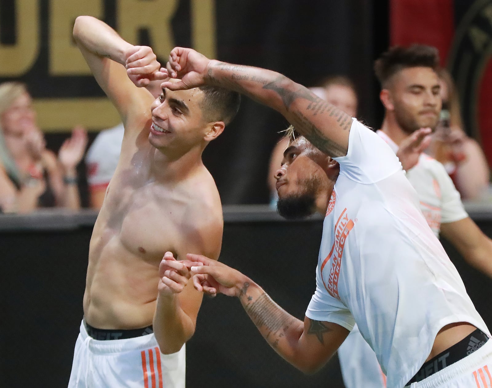 August 19, 2018 Atlanta: Atlanta United midfielder Miguel Almiron (left) celebrates his goal against Columbus Crew with Josef Martinez for a 3-1 victory during the second half in a MLS soccer match on Sunday, August 19, 2018, in Atlanta. Martinez had an assist on the goal and also tied the MLS season scoring record with his 27th goal during the first half.  Curtis Compton/ccompton@ajc.com