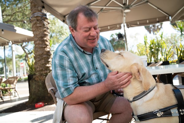 Steven Banks of Hilton Head Island with his yellow Lab guide dog, Banks, named after Atlanta Braves legendary usher Walter Banks. Banks was sponsored by the Atlanta Braves and raised as a puppy by an Atlanta family for Southeastern Guide Dogs. Photo contributed by Southeastern Guide Dogs