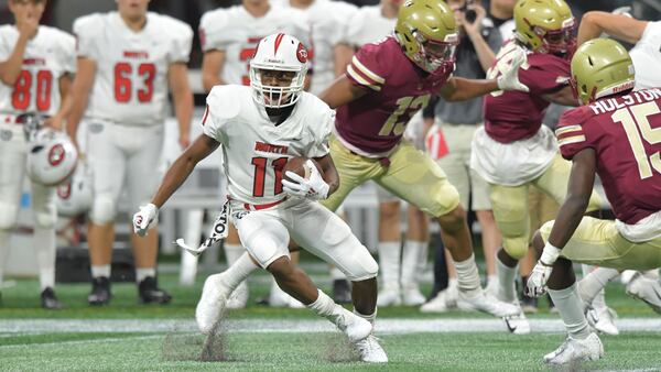 North Gwinnett wide receiver Josh Downs (11) makes a move after a catch in the second half during the Corky Kell Classic game Saturday, Aug. 18, 2018, at Mercedes-Benz Stadium in Atlanta.