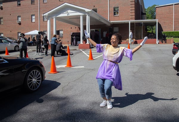 The drive-in Sunday service at the New Beginning Full Gospel Baptist Church in Decatur on Sunday was a lively scene. STEVE SCHAEFER / SPECIAL TO THE AJC