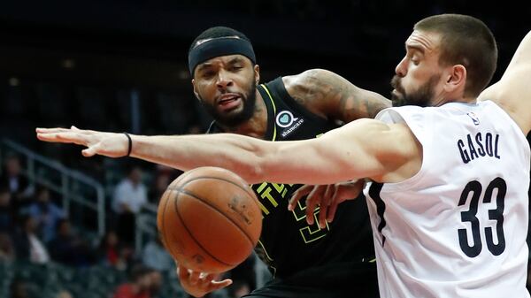 Atlanta Hawks guard Malcolm Delaney (5) drives against Memphis Grizzlies center Marc Gasol (33) in the first half Tuesday, Feb. 6, 2018, in Atlanta.