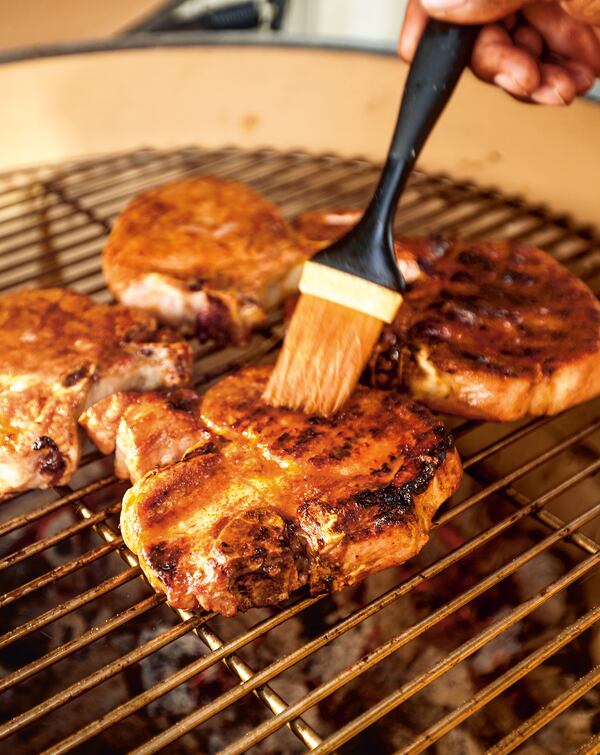 To make the Pork T-Bones from "Rodney Scott’s World of BBQ," the pork T-bone steaks should first brine for 6 to 8 hours in the fridge in a mixture using kosher salt and Rodney's Rib Rub. Jerrelle Guy/ Clarkson Potter