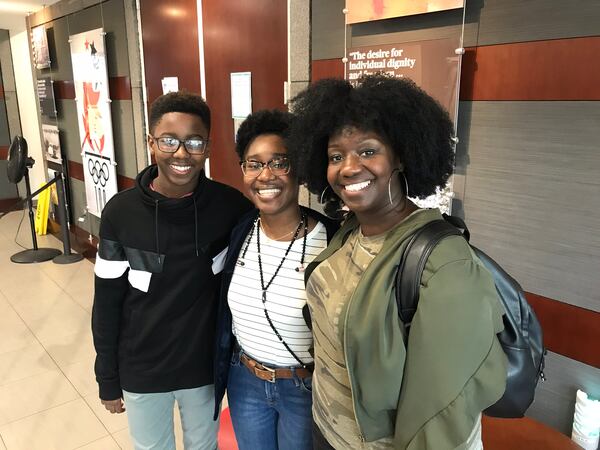  Nile King with his mom Gloria (right) and sister Divine (left). CREDIT: Rodney Ho/rho@ajc.com