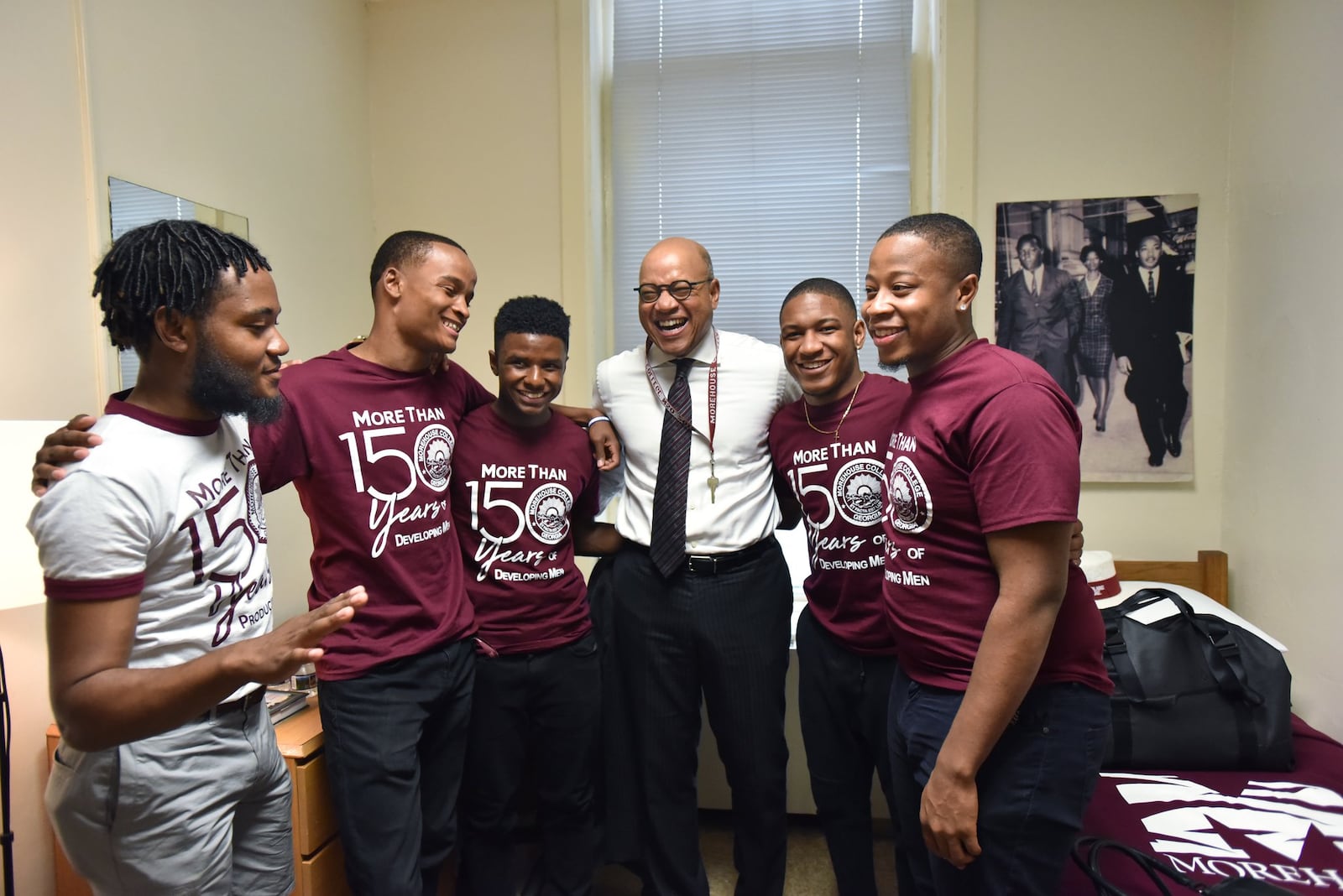 Morehouse President David A. Thomas shares a laugh with Wendell Shelby-Wallace (left), VP of the Student Government Association, and residential assistants (from second from left) Marcus Washington, MarKuan Tigney Jr., David Jeffries and Kayden Molock after he moved into his room at historic Graves Hall in Morehouse College. AJC FILE PHOTO.