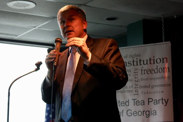 U.S. Rep. Rob Woodall, R-Ga., responds to questions at Thursday’s meeting with the United Tea Party of Georgia in Lawrenceville. Thursday, June 1, 2017. Woodall’s participation in the event was kept secret to keep away progressive critics. Like many members of Congress, Woodall has not scheduled any public town halls during the legislative break.